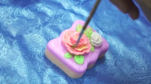 Handmade soap is being covered with the sparkles Stock Footage