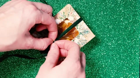 Handmade soap in festive packaging on a shiny green background. Stock Footage 169078600