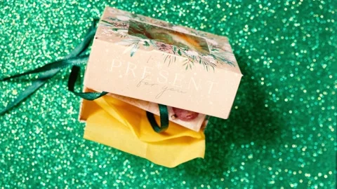Handmade soap in festive packaging on a shiny green background. Stock Footage 169078665