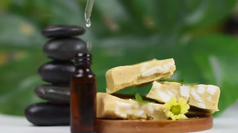 Handmade soap made from squeezing soap slivers, pyramid of stones and oil, the Stock Footage 141053249