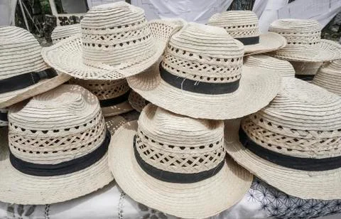 Handmade straw hats as a background Stock Photos