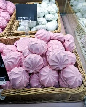 Handmade sweets on display with white and pink marshmallows in a basket dur.. Photos