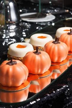 Handmade sweets on a mirror on a dark background Stock Photos
