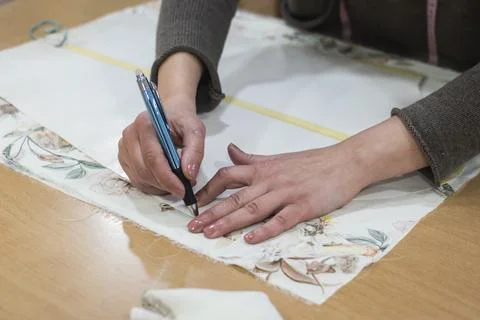 Handmade tailoring fabric cutting process Stock Photos