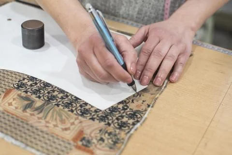 Handmade tailoring fabric cutting process Stock Photos