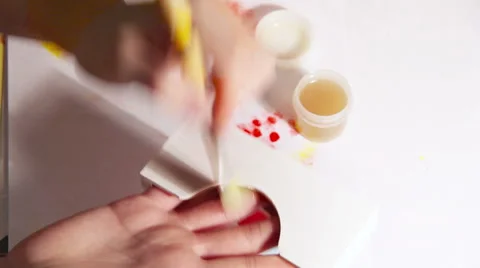 Handmade tissue-holder production process: a person primes it with a brush Stock-Footage 67742745