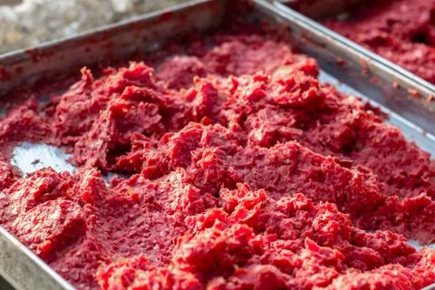 Handmade tomato paste making process shot under afternoon sun Stock Photos