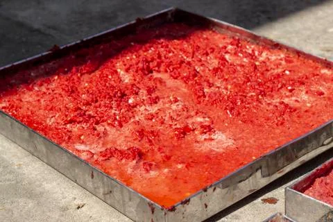 Handmade tomato paste making process at sunset time Stock Photos