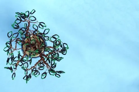 Handmade tree of beads blue background Stock Photos