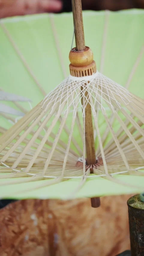 Handmade umbrella assembly close up Stock Footage 328483533