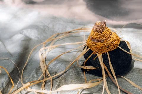 Handmade weaving basket in process of making. Craft workshop. Close up shot Stock Photos