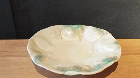Handmade white ceramic bowl on table. 스톡 동영상 339989687