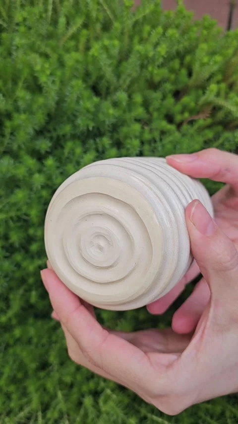 Handmade White Clay Ceramic Cup With Carved Texture Video stock 324580330