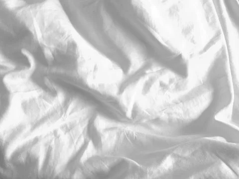 This handmade white fabric, with its subtle wrinkled pattern, adds a touch .. Stock Photos