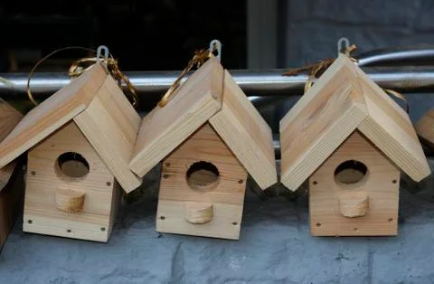 Handmade wooden nesting boxes placed on a counter Stock Photos