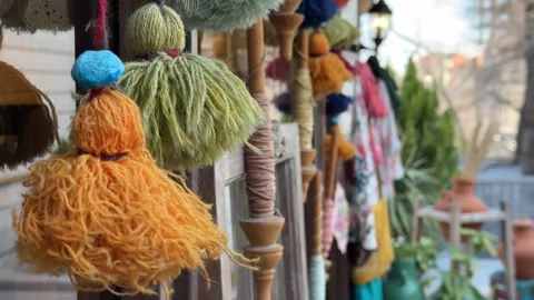 Handmade wool accessories using Persian carpet leftover making colorful yarn Stock Footage 316371482