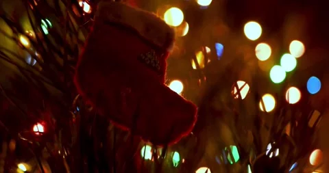 Handmade Wool Felt Christmas Stocking Hanging as Ornament on Sparkling Tree with Stock Footage 330956403