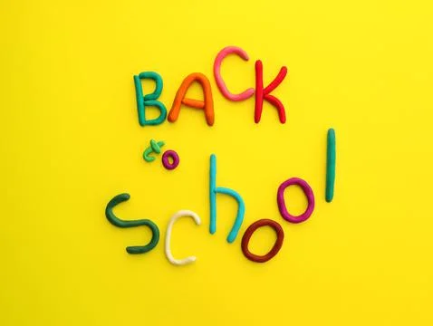 Handmade words of multi-colored plasticine back to school in wry funny style  Stock Photos