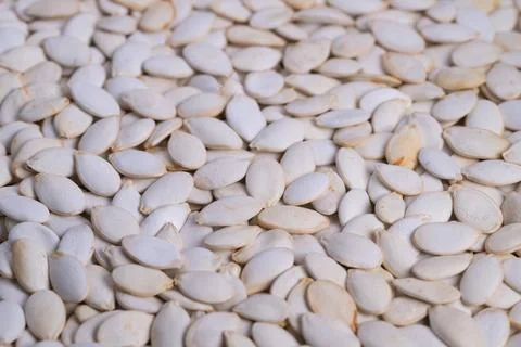 Handpicked pumpkin kernels with matte surface texture, Closepacked pumpkin seeds 스톡 사진