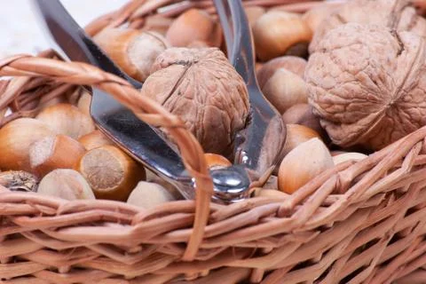 Handpiece for cracking nuts in basket close view Stock Photos