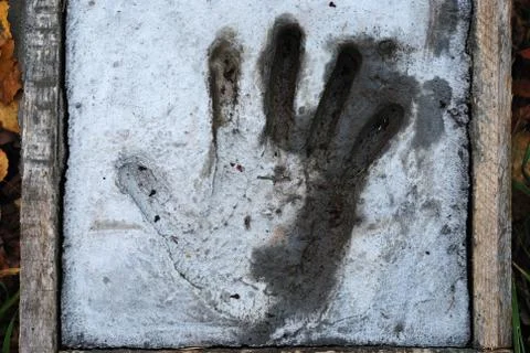 Handprint in cement Stock Photos