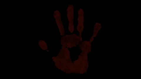 Handprints flashing on black background Stock Footage 253231078