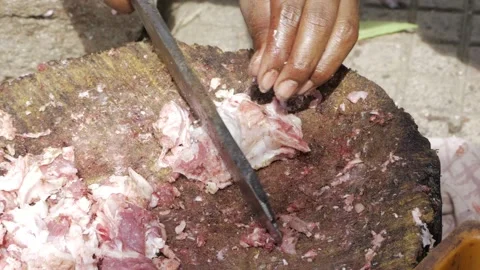 Hands in Action  Deftly Peeling Fresh Meat Stock Footage 323998600