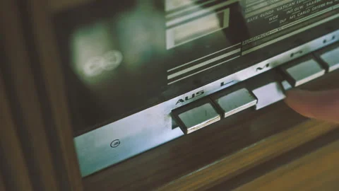 Hands Activating Push Buttons on Vintage Radiogram Player Stock Footage 331750254