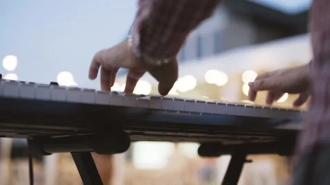 Hands actively plays electronic piano, presses white keys of musical instrument Stock Footage 145940222