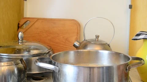 Hands adding pepper into saucepan using pepper mill Stock Footage 67309584