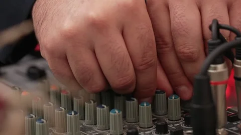 Hands adjusting audio mixer knobs 스톡 동영상 304107140