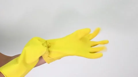 Hands Adjusting Durable Cleaning Gloves for Washing, Disinfecting, and Skin Stock Footage 305777455