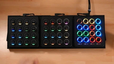 Hands adjusting knobs and pressing buttons on a captivating futuristic Stock Footage 102087230