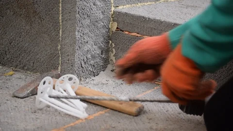 Hands affixing polystyrene panel on foundation Stock Footage 88292210