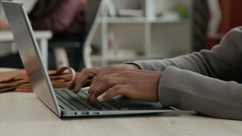 Hands of African American Office Worker Typing on Laptop Stock Footage 333388704