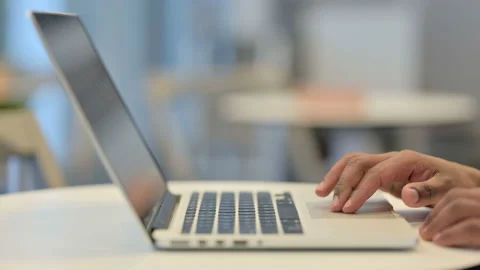 Hands of African Man Using Laptop Cursor, Close Up Stock Footage 146483719