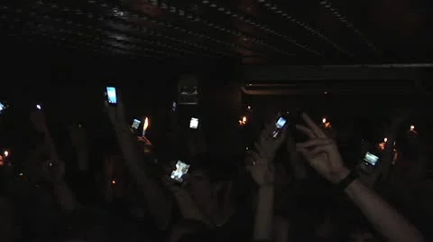 Hands in the air with lighters on a party Stock Footage 22425305