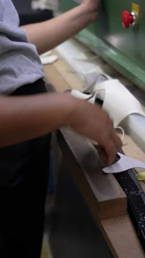 Hands Align Black Cutting Die in Manufacturing Workshop Vertical Stock Footage 340182886