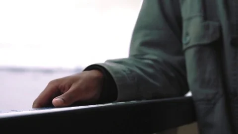 Hands along the railing of the Staten Island Ferry Stock Footage 76540479