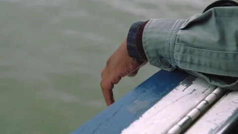 Hands along the railing of the Staten Island Ferry Stock Footage 76540510