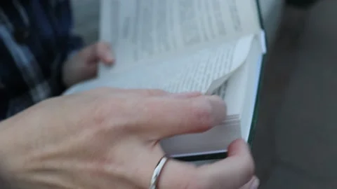 Hands and book Video stock 233702078