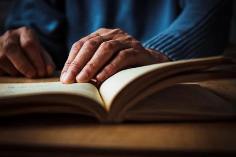 Hands and book Stock Photos