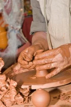 Hands and clay. Stock Photos