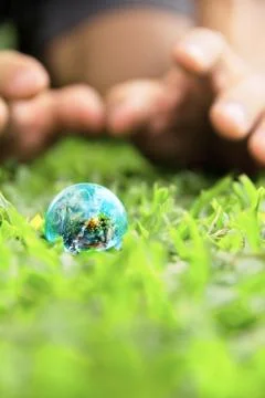 Hands and Earth. Concept Save green planet. Stock Photos