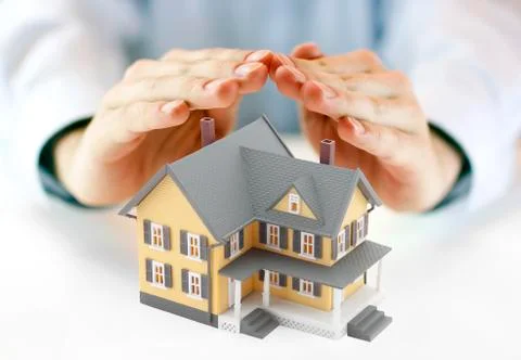 Hands and house model Stock Photos