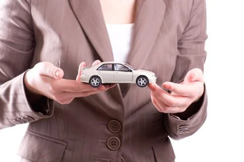 Hands and model of car Stock Photos