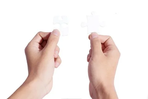 Hands and puzzle Foto stock