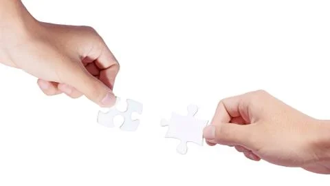 Hands and puzzle Stock Photos