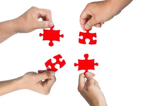 Hands and puzzle Stock-Fotos