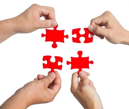 Hands and puzzle Stock Photos
